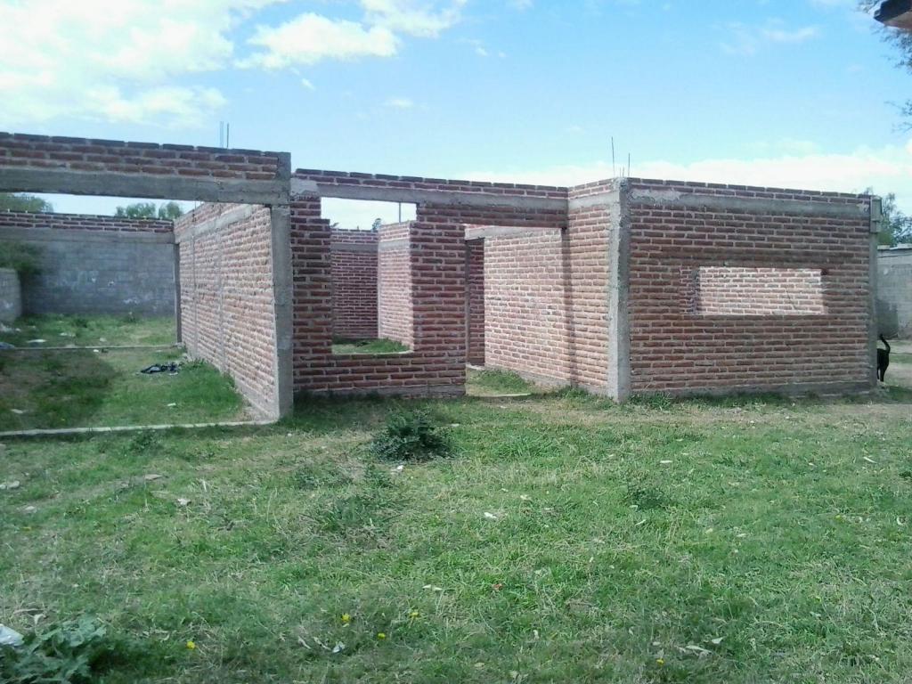 Vendo o permuto terreno con construcción